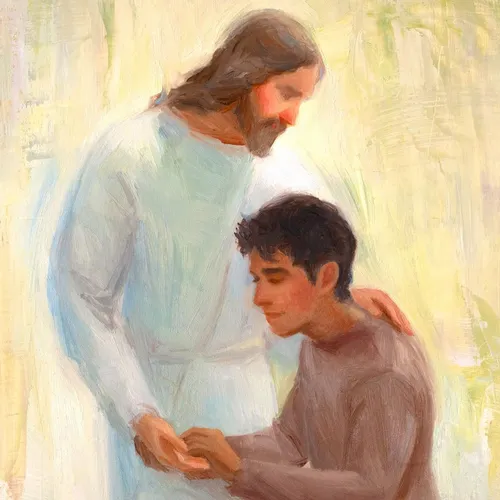 man kneels before Jesus and holds His hand