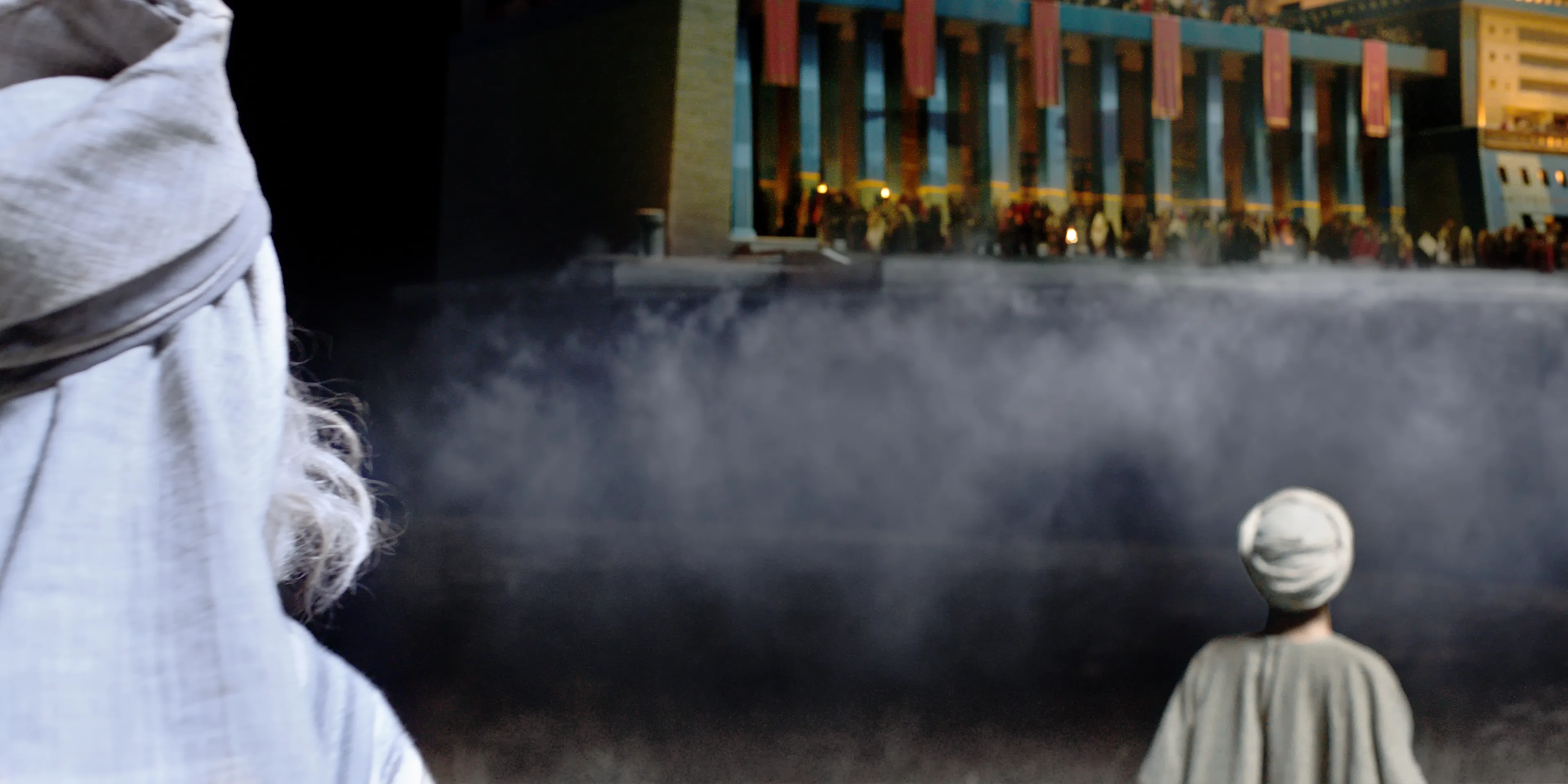 Lehi looks up at the great and spacious building which is above him in the air.