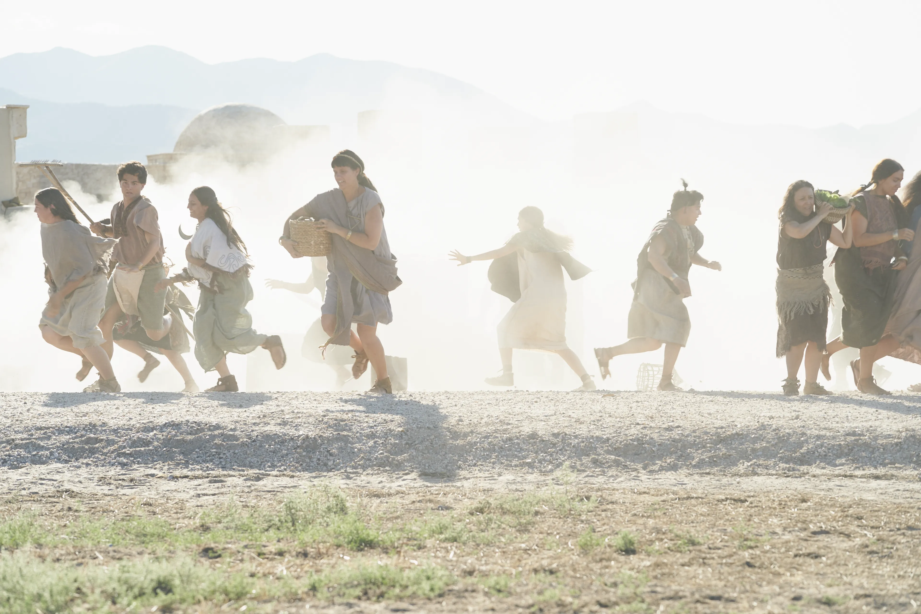 The people of Ammonihah flee from the prison as it collapses.