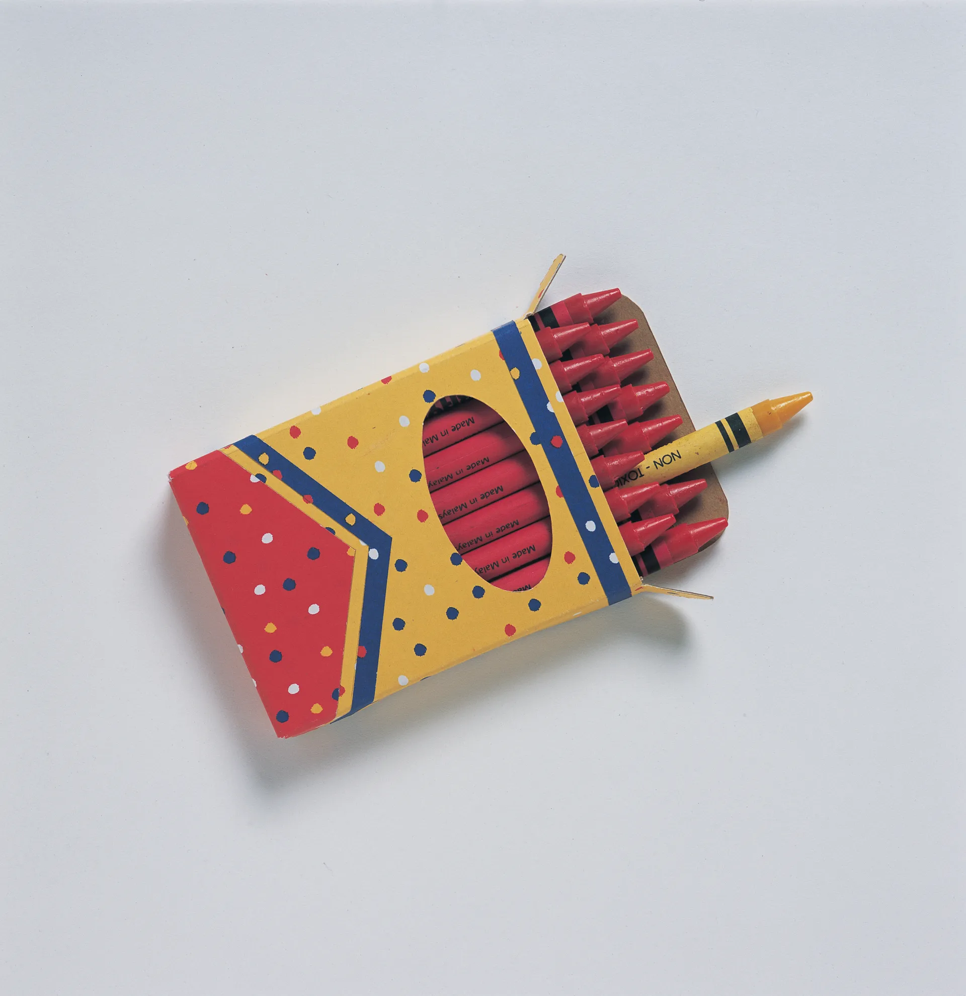 One yellow crayon in a box of red crayons.