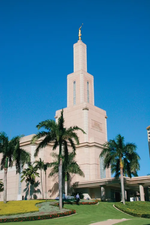 A front and side view of the Santo Domingo Dominican Republic Temple, including a partial view of the entrance.