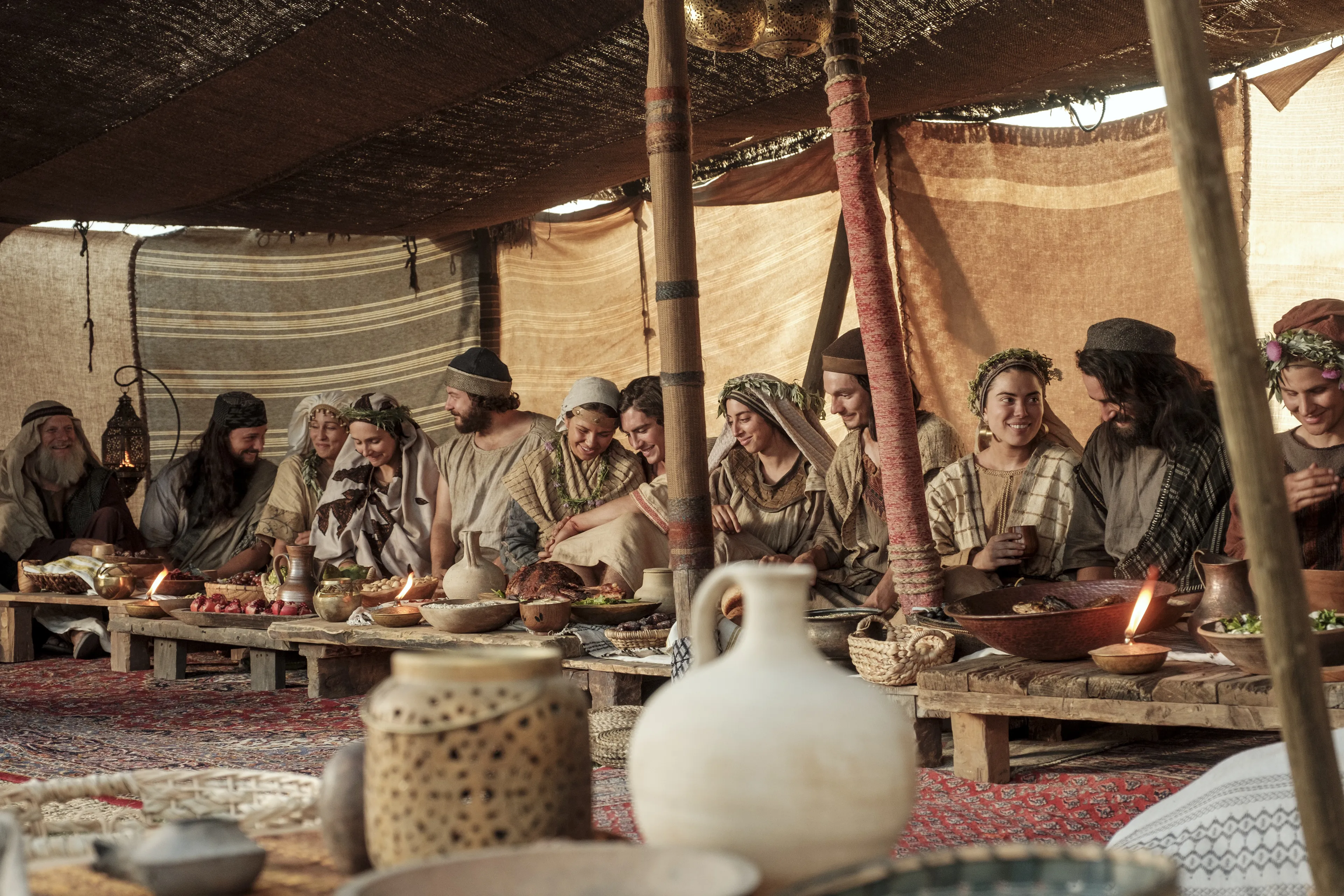 Lehi and Ishmael's families celebrate at the wedding feast in the wilderness.