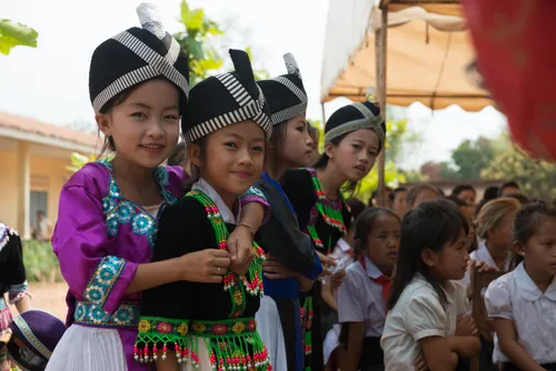 Girl students are dressed up and ready to perform at the ceremony thanking LDS Charities for donating wells and toilets to their schools.