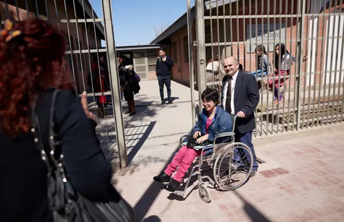 people greeting each other outside of a church building
