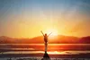 triumphant person in the sunrise