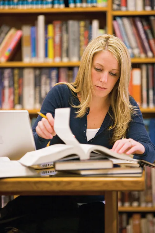 young woman in library