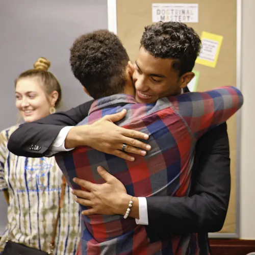 Garret W hugging someone