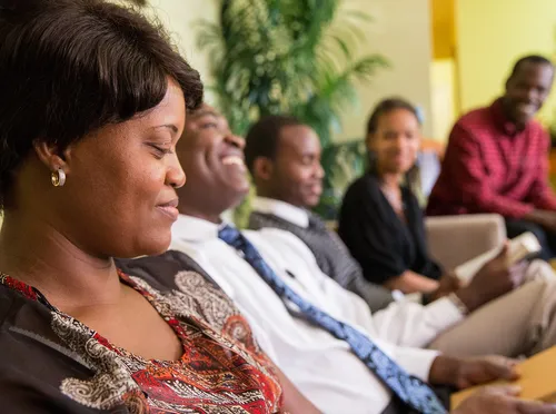 family sitting on sofa