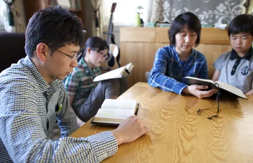 family studying the scriptures together
