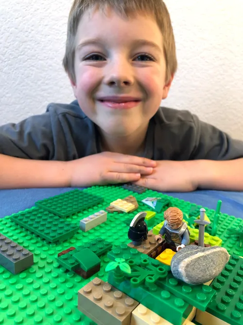 Boy with homemade scene of Moroni burying the plates