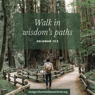 man standing at fork in a path