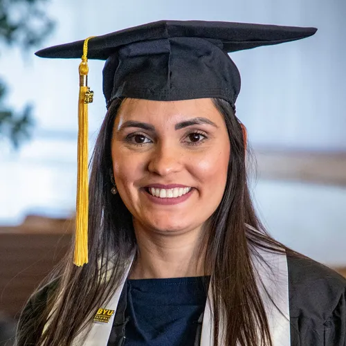 young adult woman wearing graduation cap