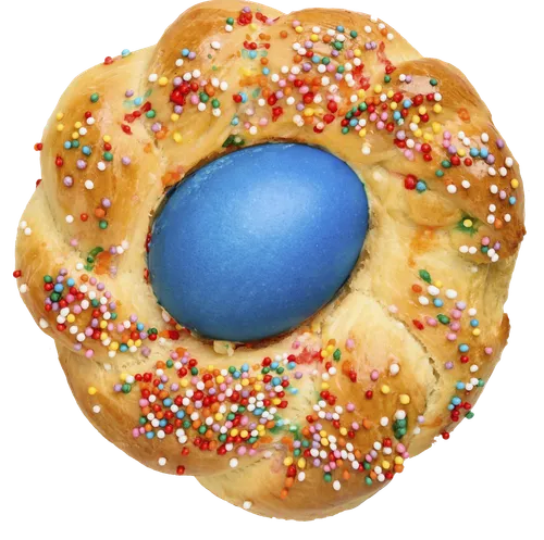 round loaf of bread with colored egg in the middle