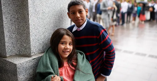 brother and sister at conference