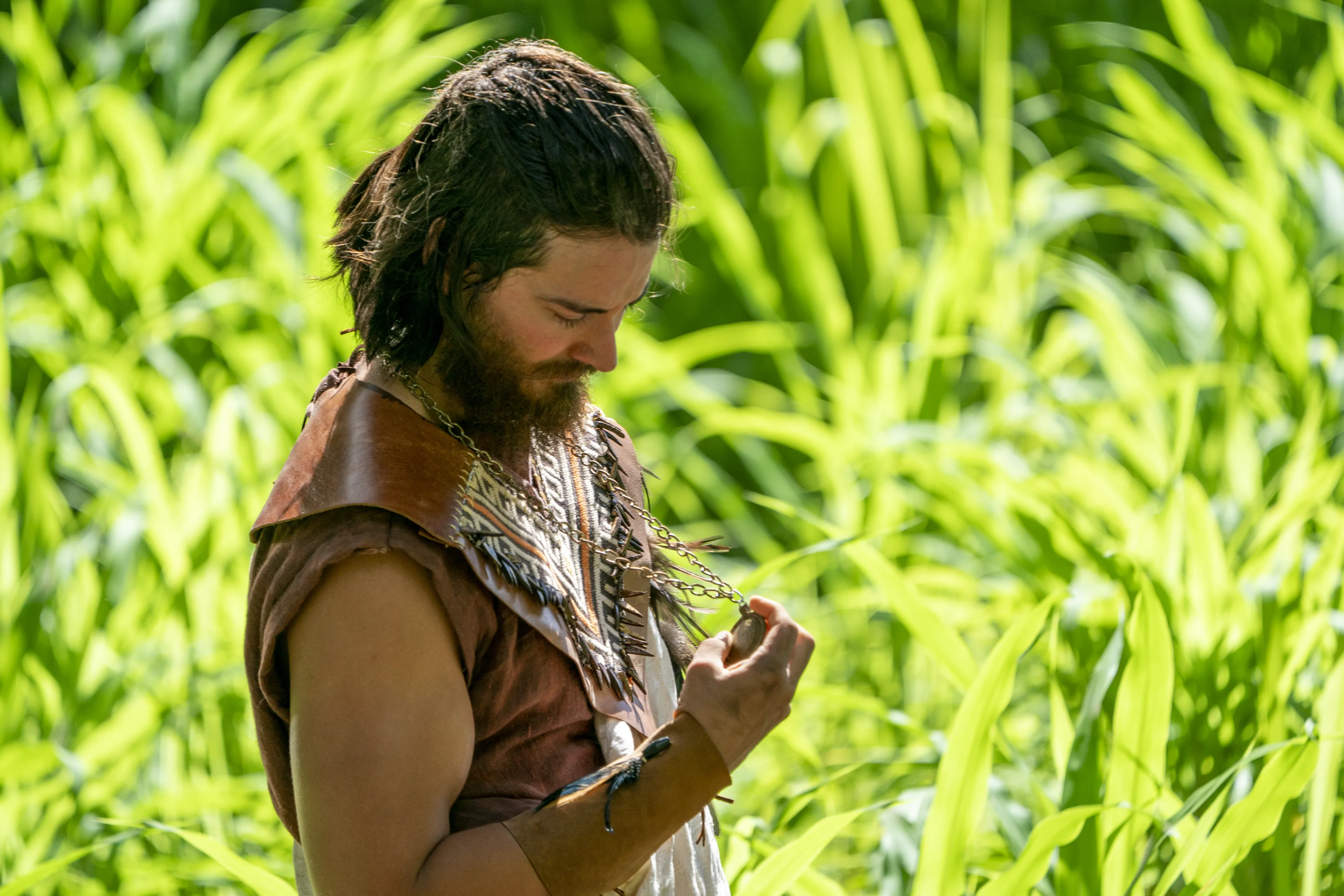 Alma kneels next to a pool of water and prays. He is near the Waters of Mormon.