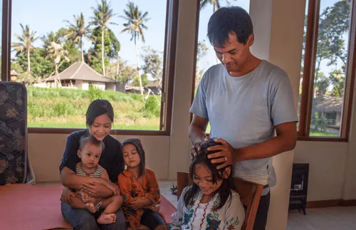 a father blessing his daughter