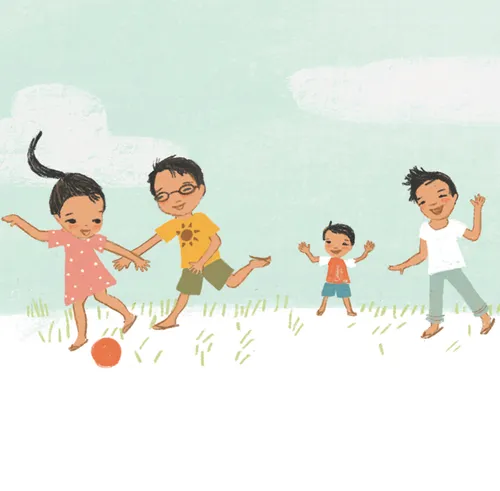 children kicking a ball outside