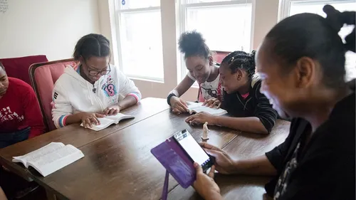 family reading scriptures together