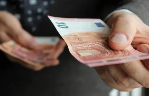 Euro banknotes in hands