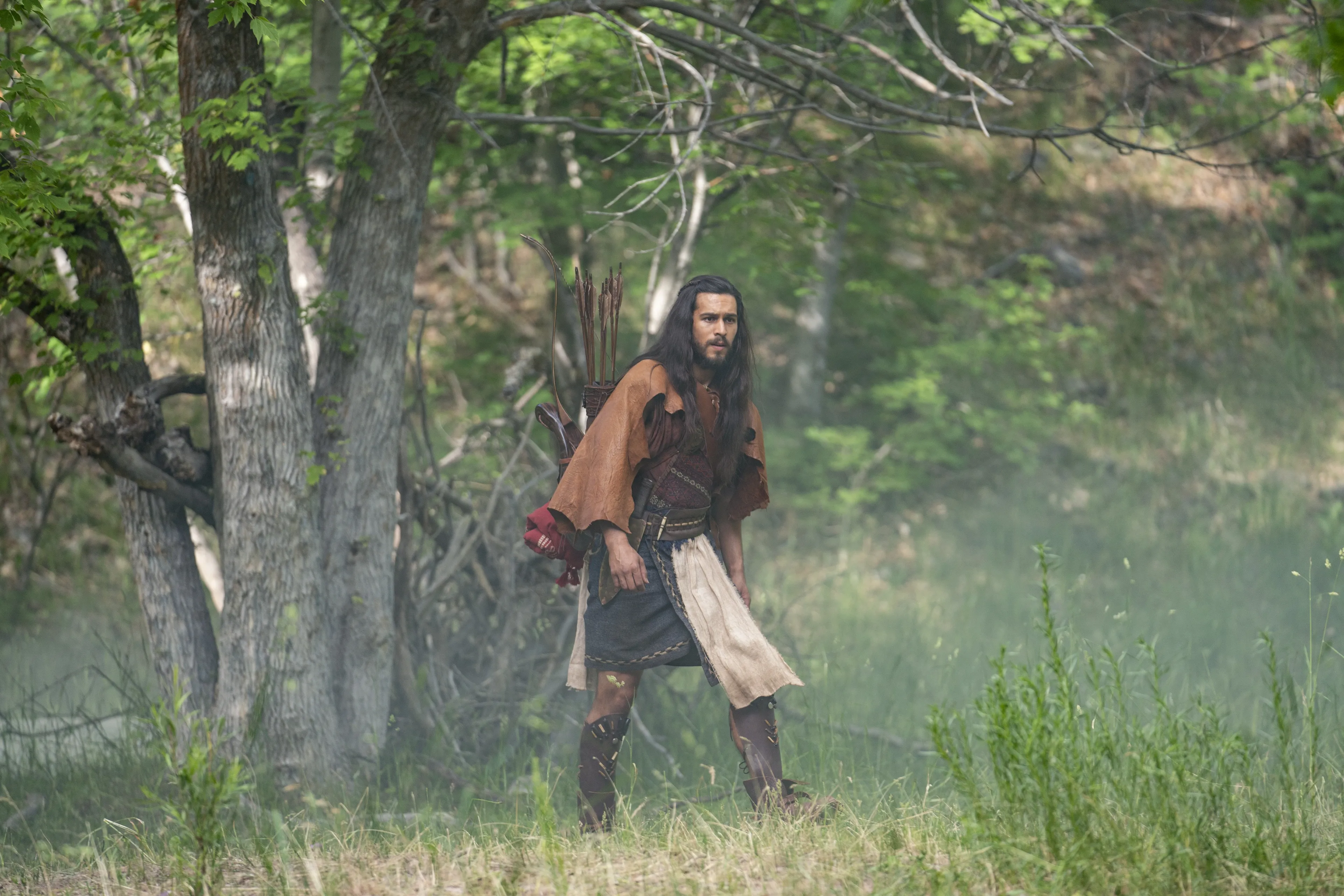 Enos hunts in the woods.