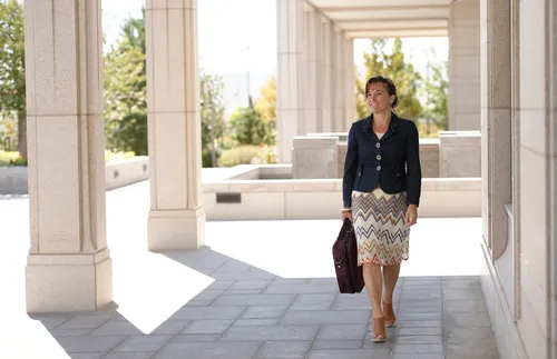 woman walking outside temple