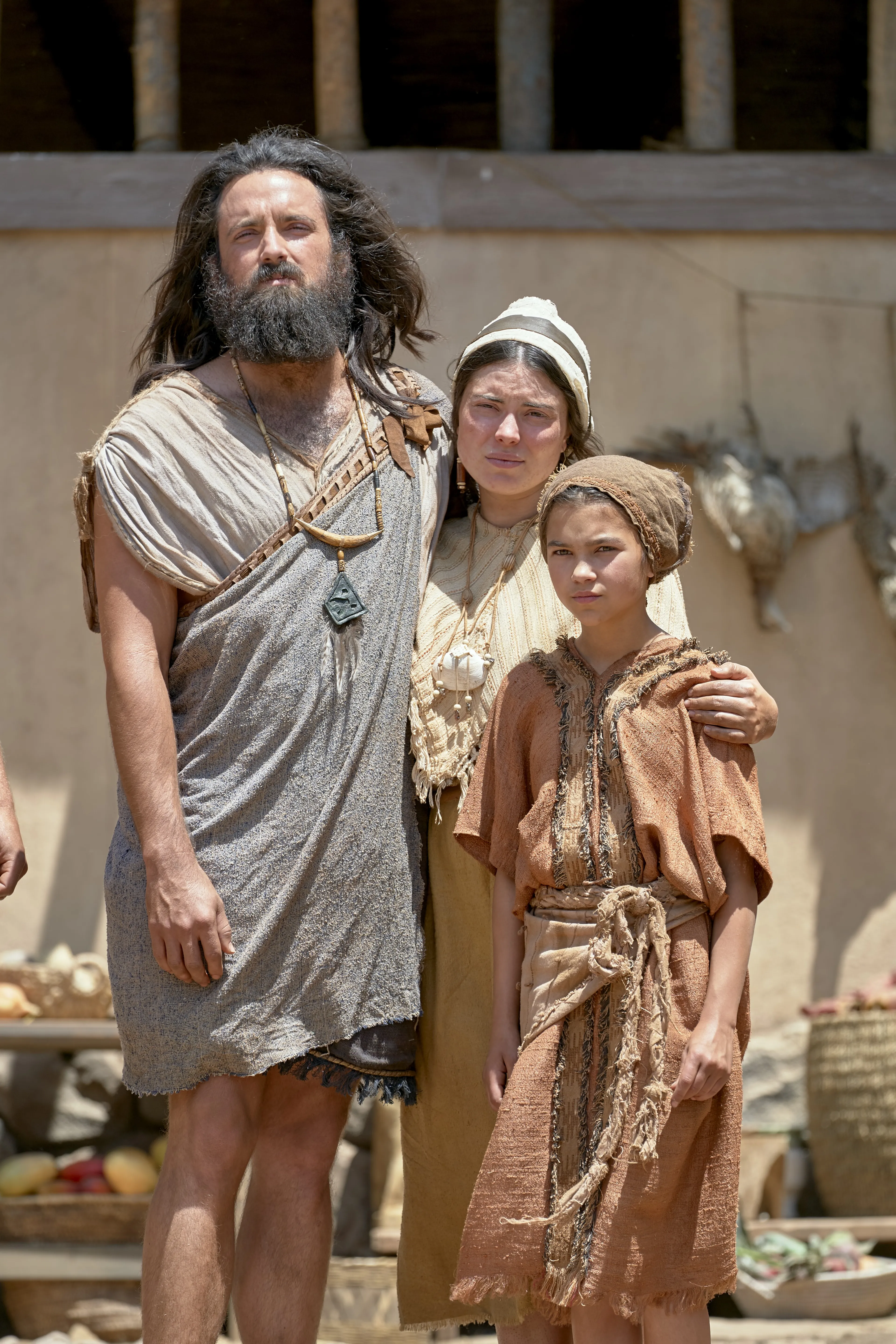 Lemuel listens to Lehi with wife and child.