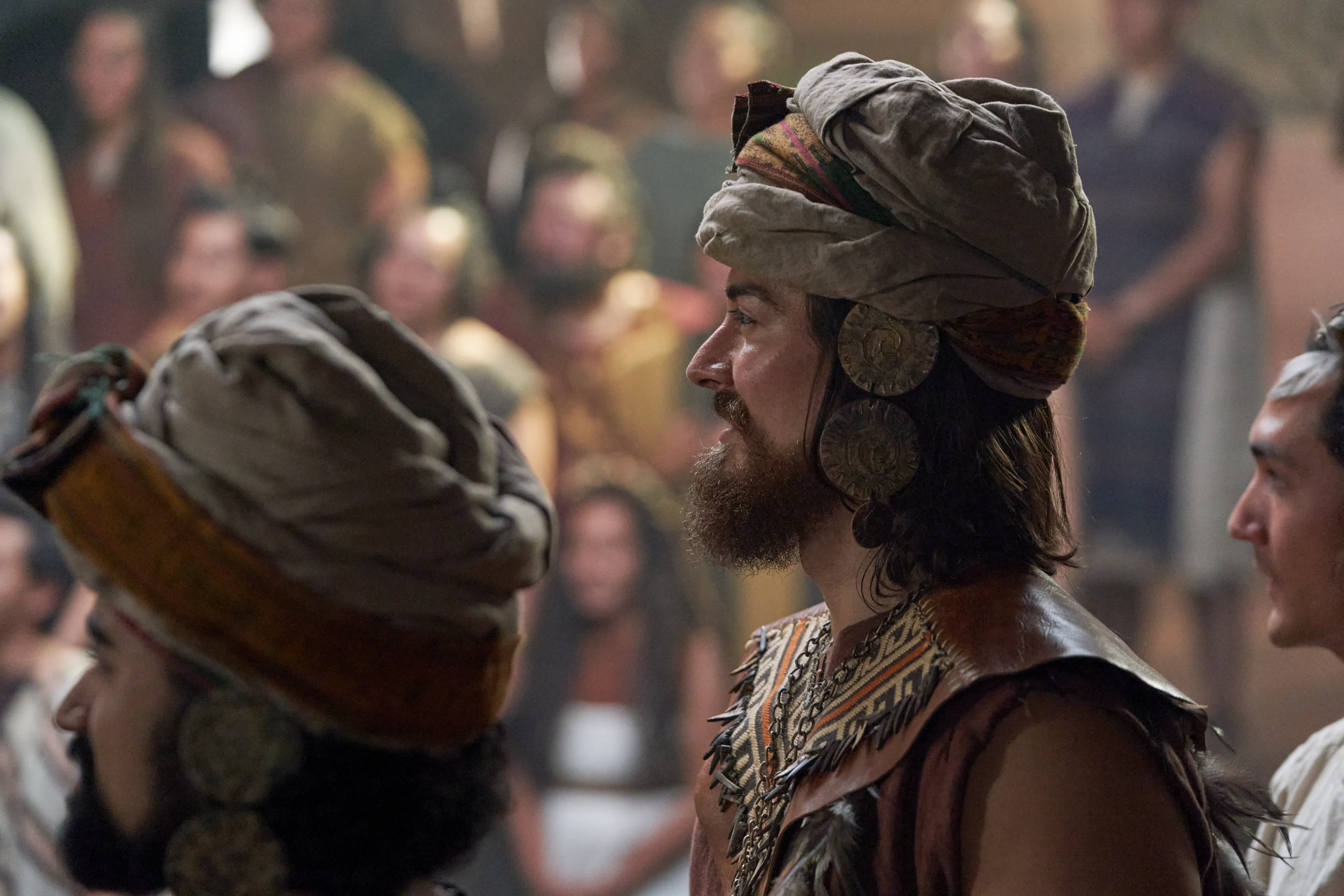 Alma watches as King Noah escorts his new priests into the court.