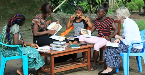 Jean B. Bingham with sisters in Sierra Leone.