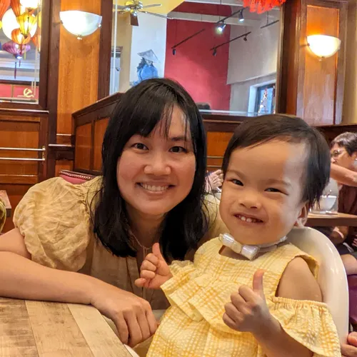 a mother and her daughter smiling