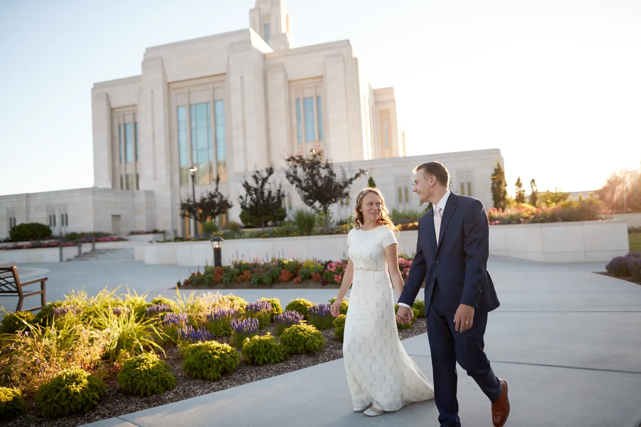 A couple exit the temple after experiencing the blessings of marriage in the temple
