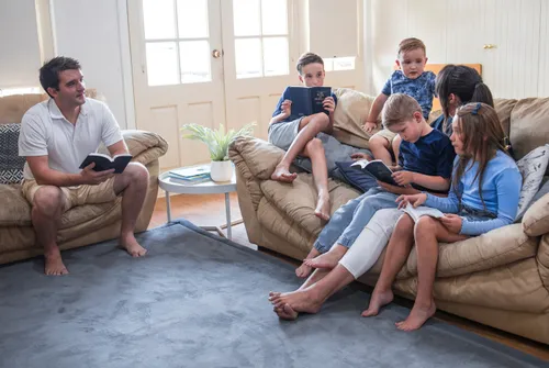 Image of Lirael with her family reading the scriptures
