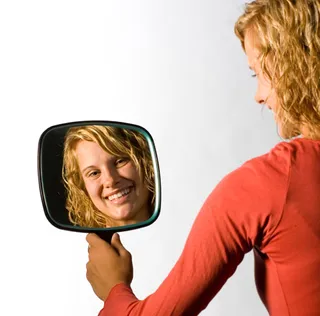 girl looking in mirror