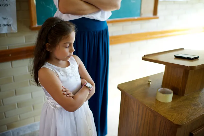 A young girl praying in church