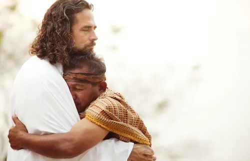 Jesus embracing a man
