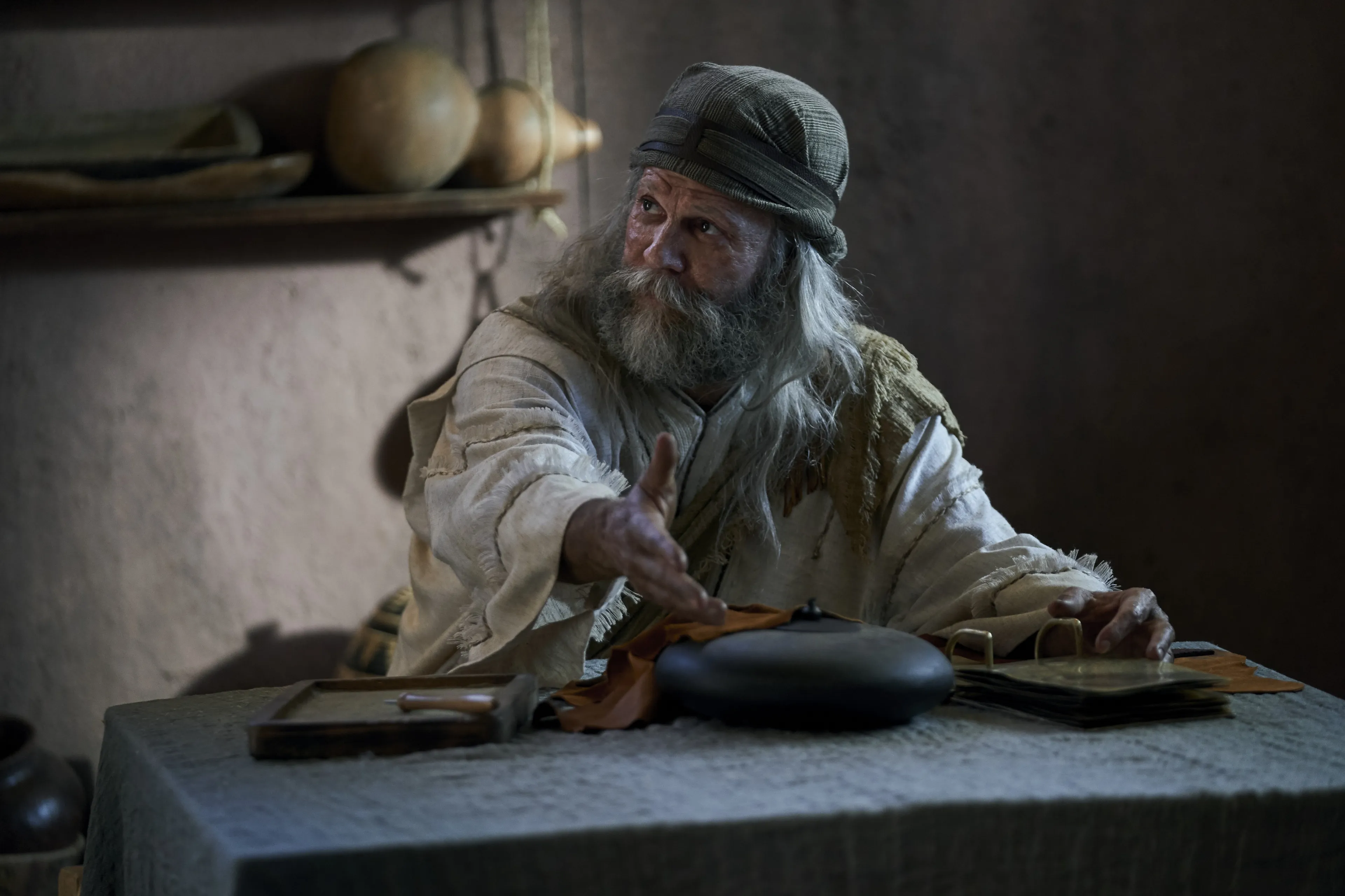 Jacob invites Enos to sit with him.