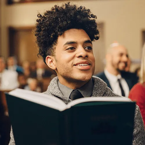 young man singing in church