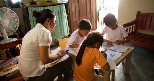 mother helping children