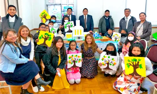 Primary children with artwork