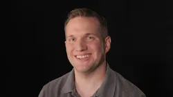 A man speaking to camera about the loss of his child