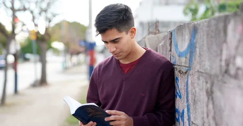 young man reading scriptures