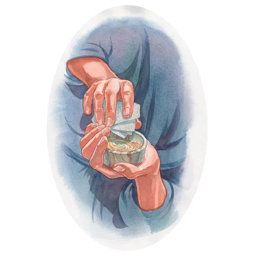 hands opening a box of ointment