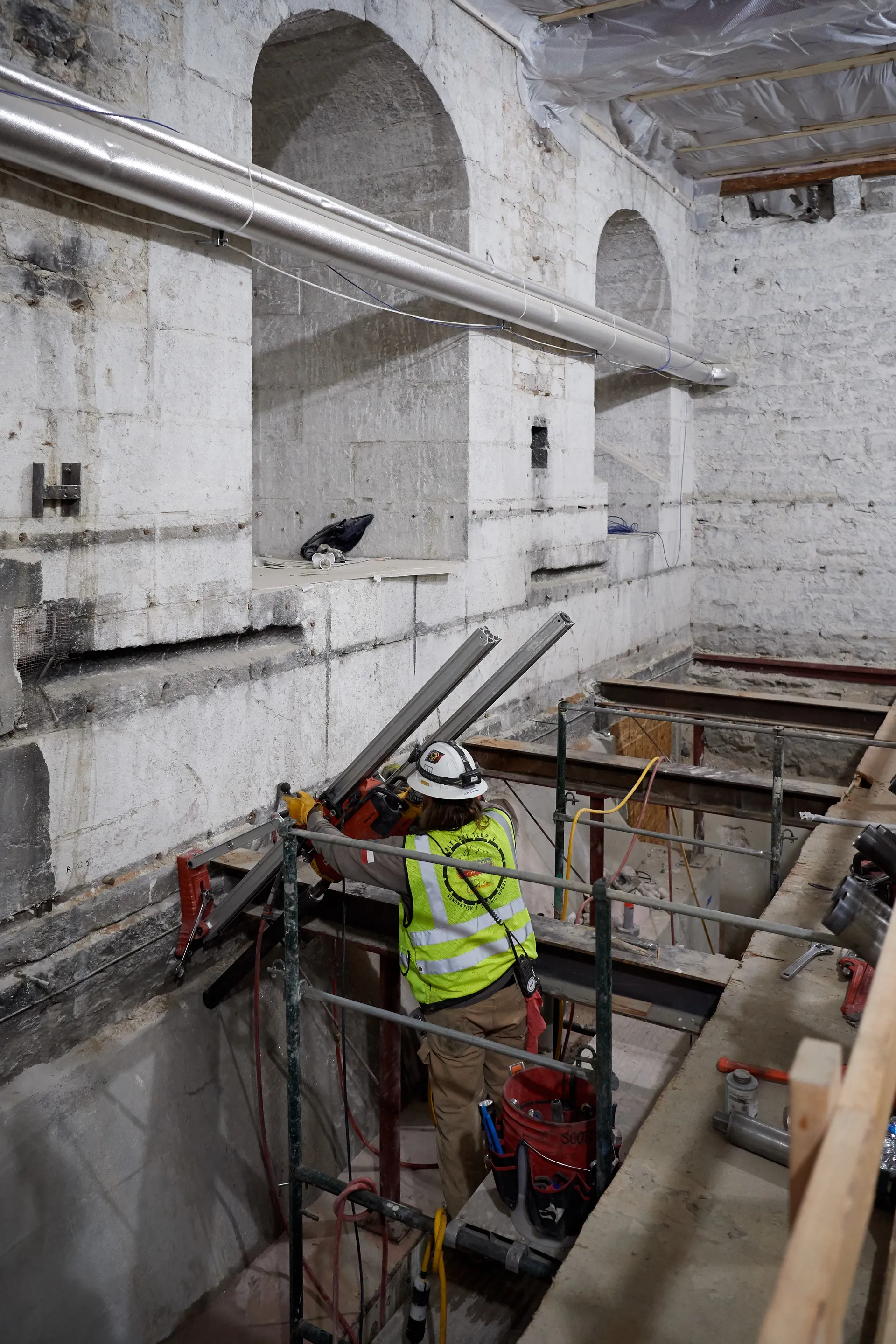 Construction on the Salt Lake Temple during September, 2020. Construction workers are working inside the temple. 