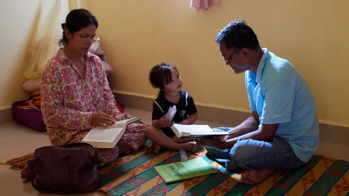 family reading the scriptures together
