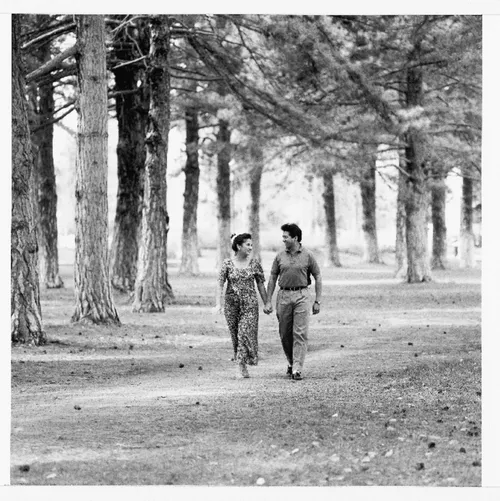 couple holding hands in the park