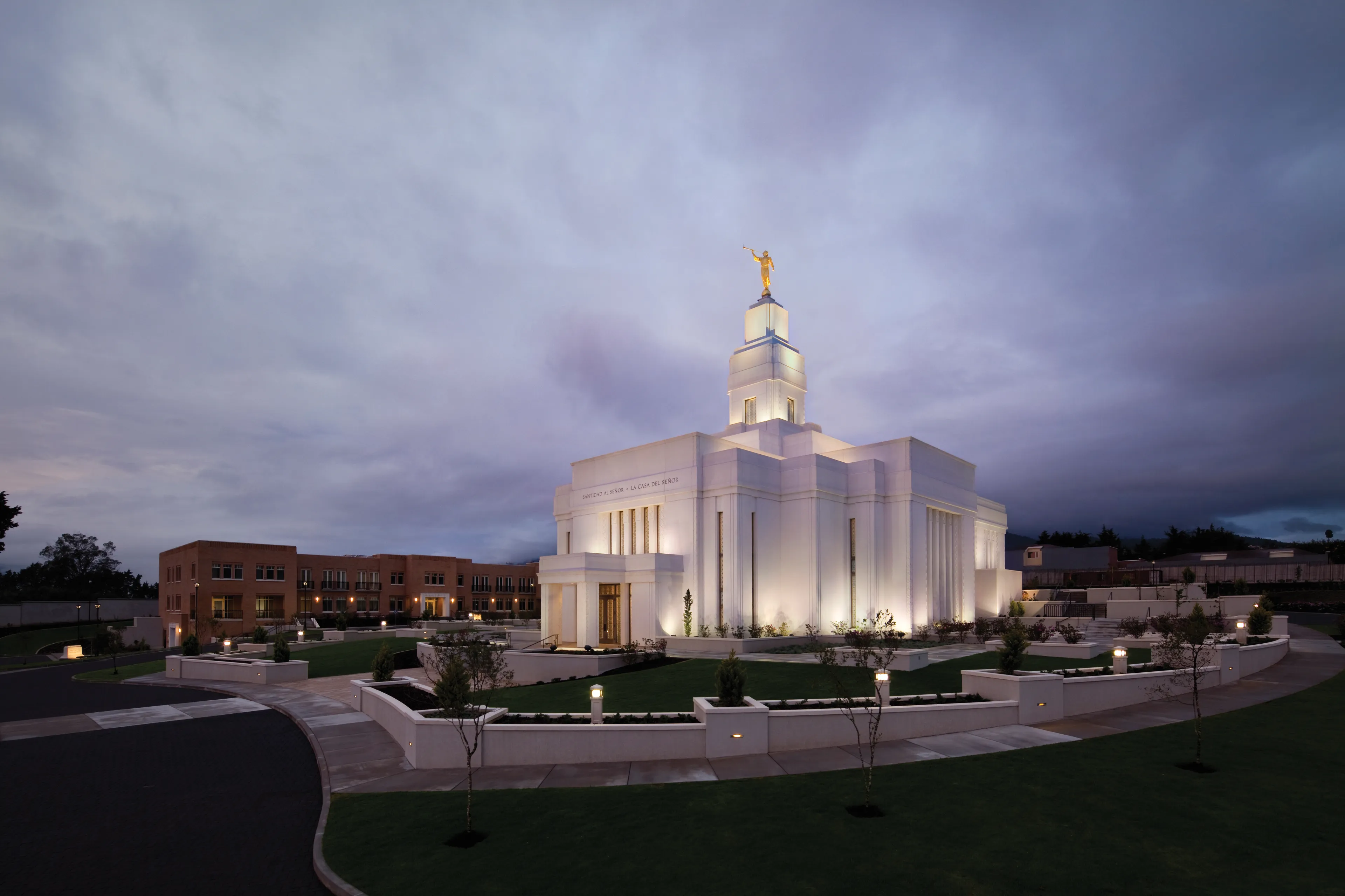 The Quetzaltenango Guatemala Temple in the evening, including the entrance and scenery.