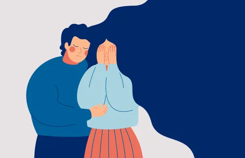 man comforting a crying woman