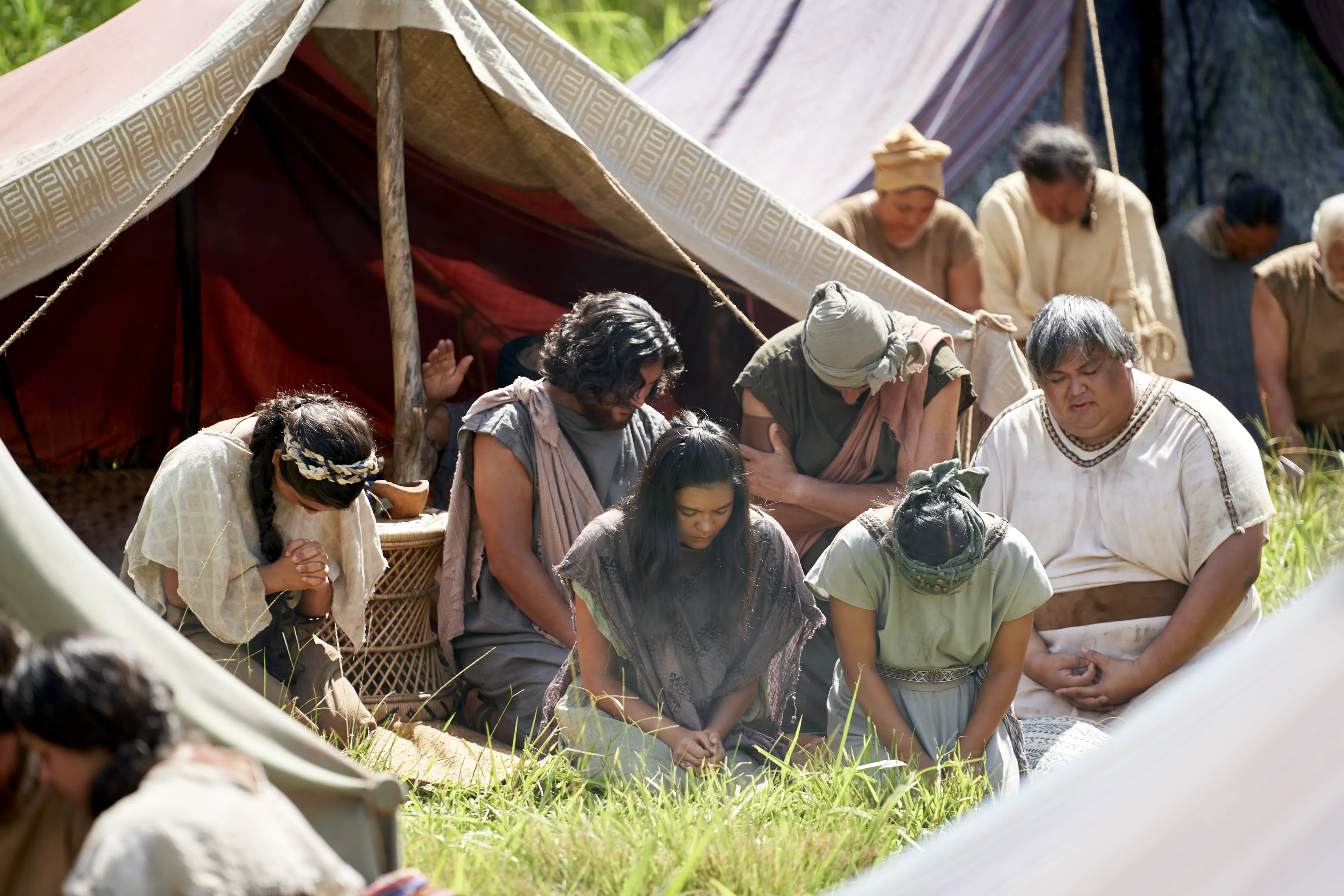 Men and women gather to listen to King Benjamin in the Land of Zarahemla.