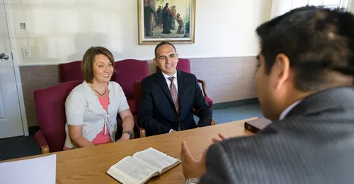 couple talking to bishop