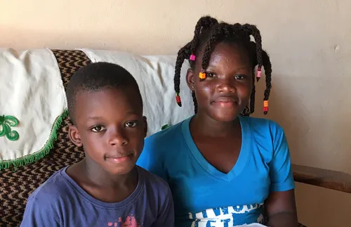 brother and sister reading scriptures together
