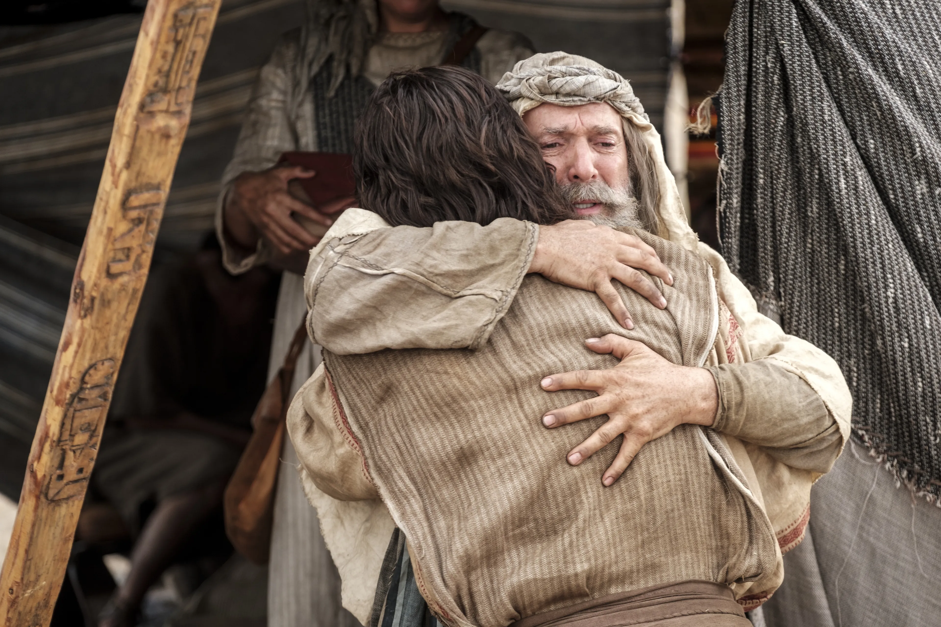 Lehi embraces Nephi after he asks whither to go to obtain food in the wilderness.